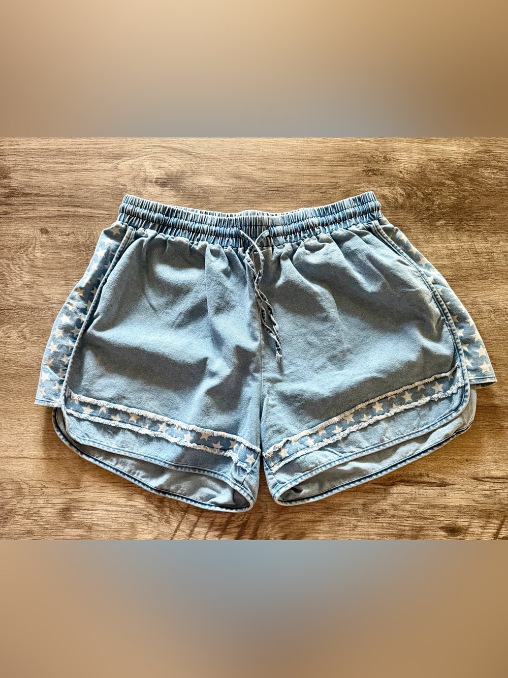 Light denim star shorts